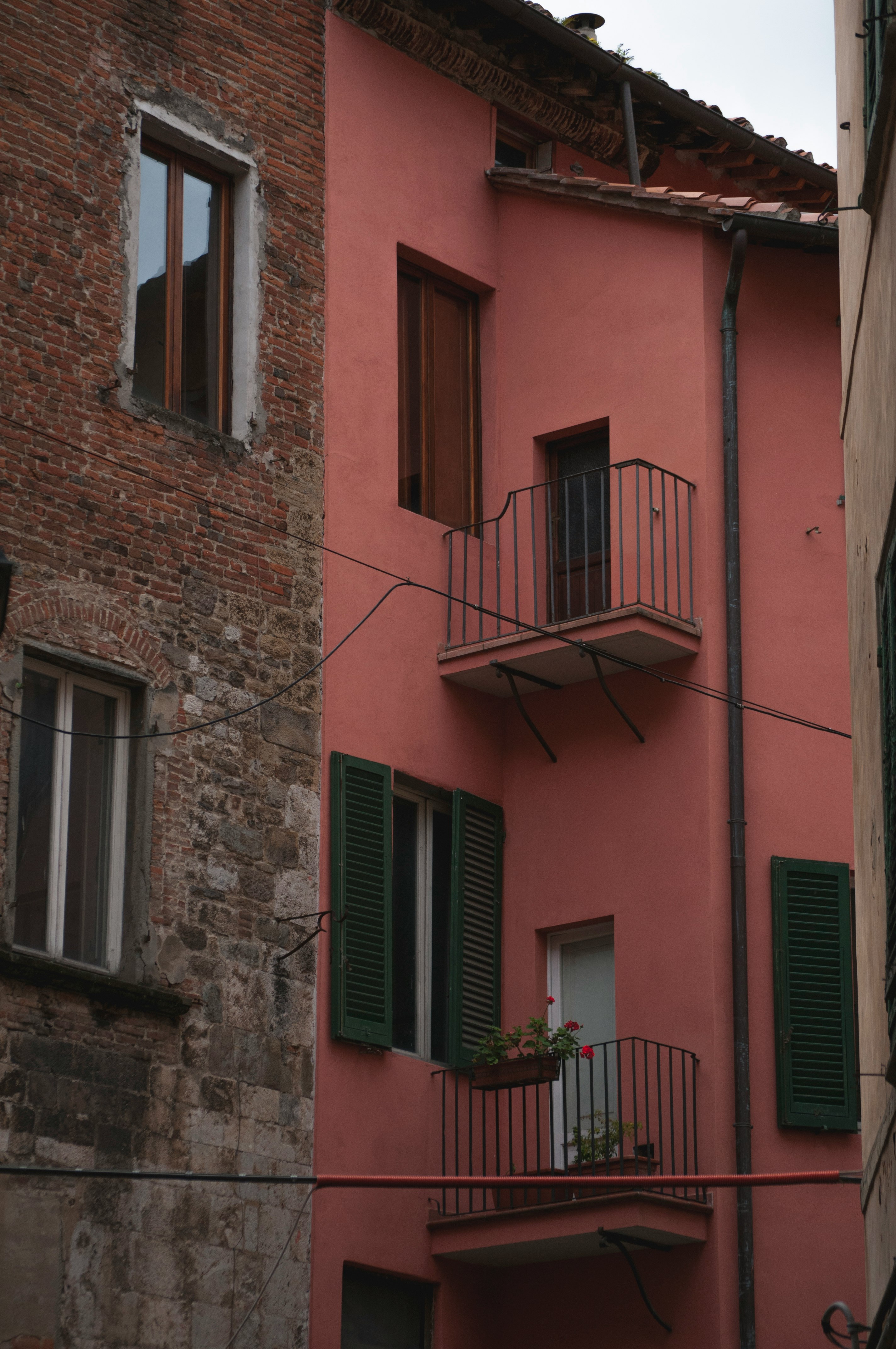 brown and pink concrete multi-storey building